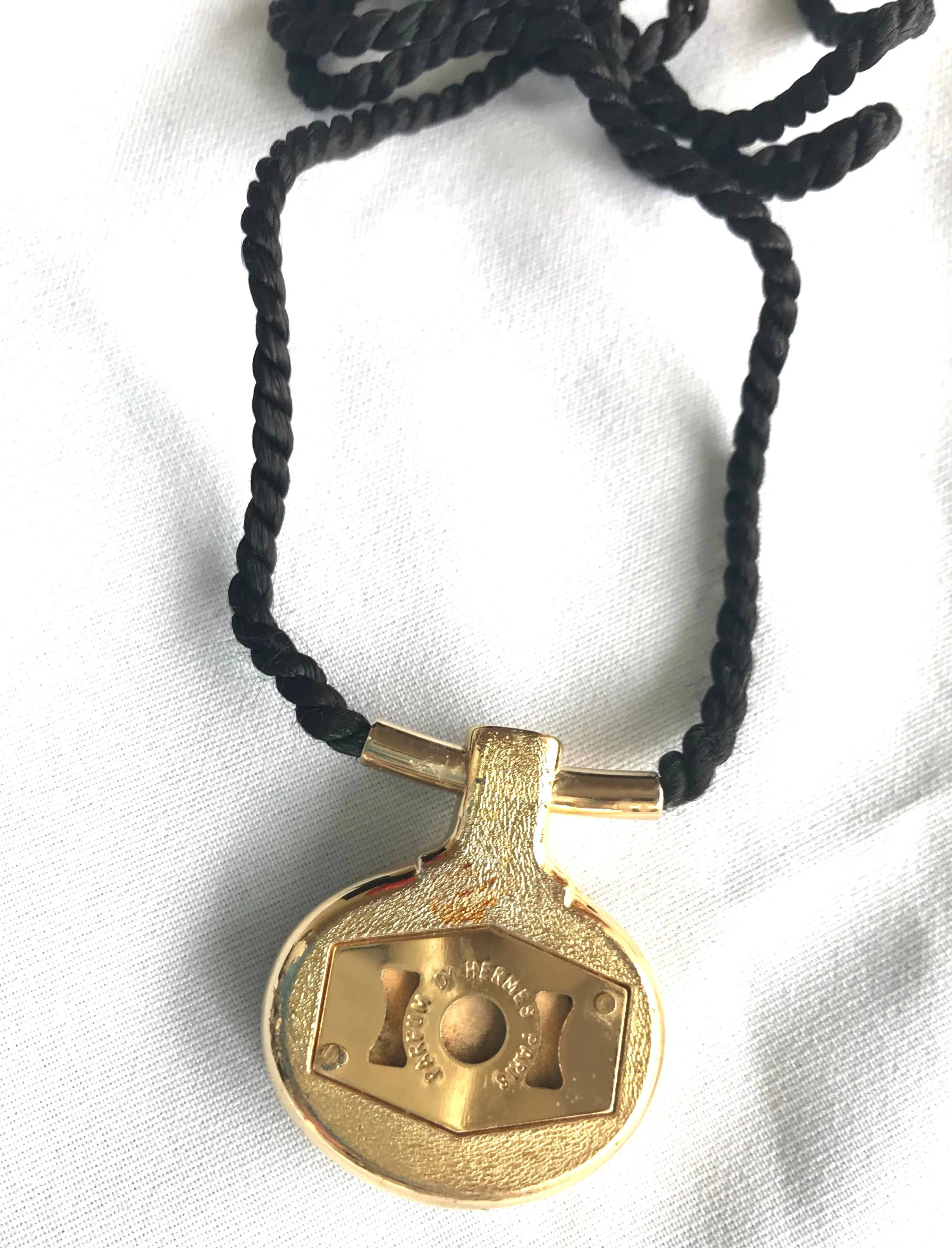 Vintage Hermes golden and red stone charm pendant top necklace with black strings. Unique jewel piece from PARFUM Collection. 060919re1